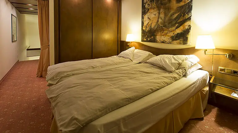 Bett im Derag Livinghotel am Weißensee